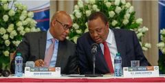 File image of President Uhuru Kenyatta (left) with East African Community Cabinet Secretary Adan Mohamed