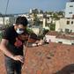 Cuban violinist William Roblejo rehearses on the rooftop of his house in Havana