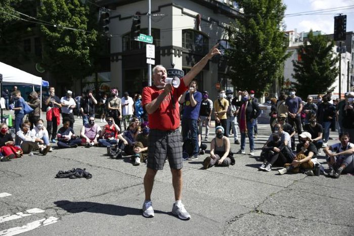 Human Rights Attorney Mike Withey, a veteran of major protests in 1999 against the World Trade Organization (WTO) protests, addresses demonstrators in the CHAZ zone