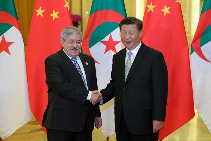 Chinese President Xi Jinping shakes hands with then Algerian prime minister Ahmed Ouyahia in Beijing in 2018