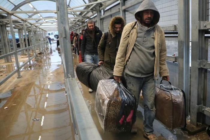 Palestinian labourers enter Israel to work after being told to decide whether to stay there throughout the coronavirus crisis or return to the West Bank