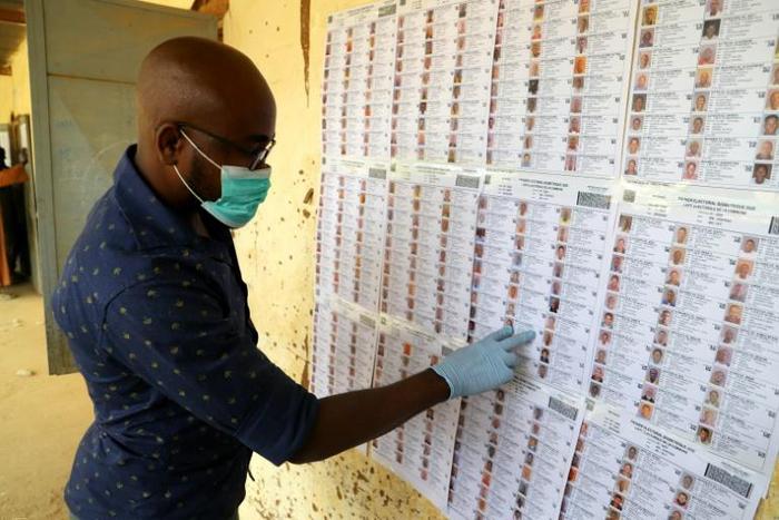 Face masks and gloves are new to election workers preparing polling stations for Mali's vote