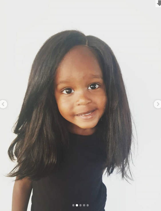 Njugush and Wakavinye's son in a wig (Instagram)