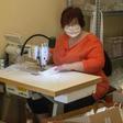 A woman sews masks in the workshop of a small Czech company as tens of thousands of Europeans join forces via social media to combat a dire global shortage