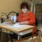 A woman sews masks in the workshop of a small Czech company as tens of thousands of Europeans join forces via social media to combat a dire global shortage