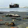Belongings of Rohingya refugees rest on the shore as their boat remains anchored off Teknaf in Bangladesh on Thursday