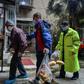 Wuhan residents considered healthy are allowed to move around the Chinese city and take the bus or metro so long as they show ID