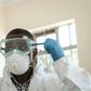 Virus threat: A lab technician gears up for visiting a quarantine ward at the Kenyatta National Hospital in Nairobi