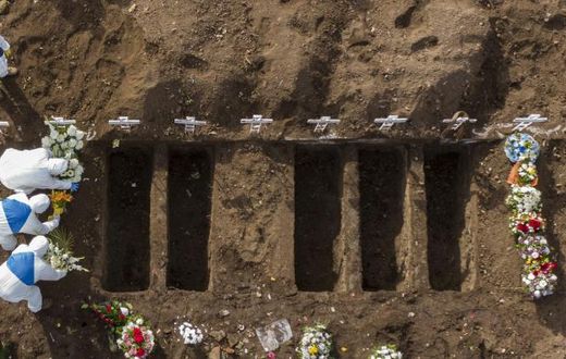 A COVID-19 victim is buried at the General Cemetery in Santiago, Chile