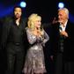 Kenny Rogers, pictured with Lionel Richie, came to prominence through his collaboration with Dolly Parton