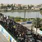 Large numbers of Iraqi Shiites defy curfews imposed to stem the spread of the coronavirus to commemorate a revered imam