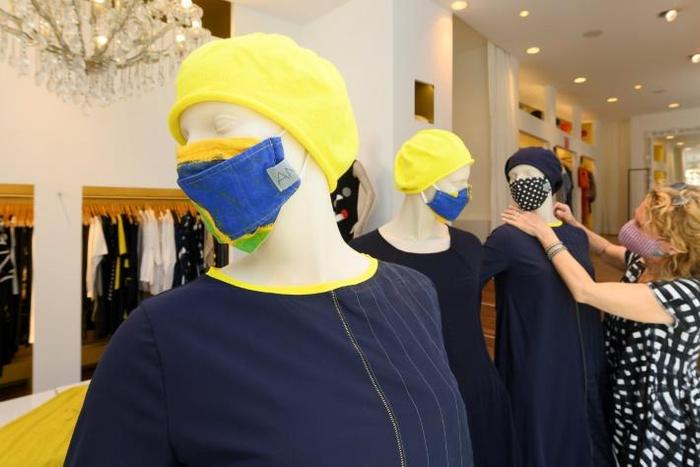 Some small shops in Germany began to reopen Monday after a weeks-long national lockdown