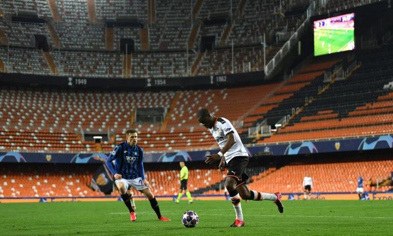 Atalanta's Josip Ilicic (L) scored four goals in a Champions League game played without fans in Valencia.