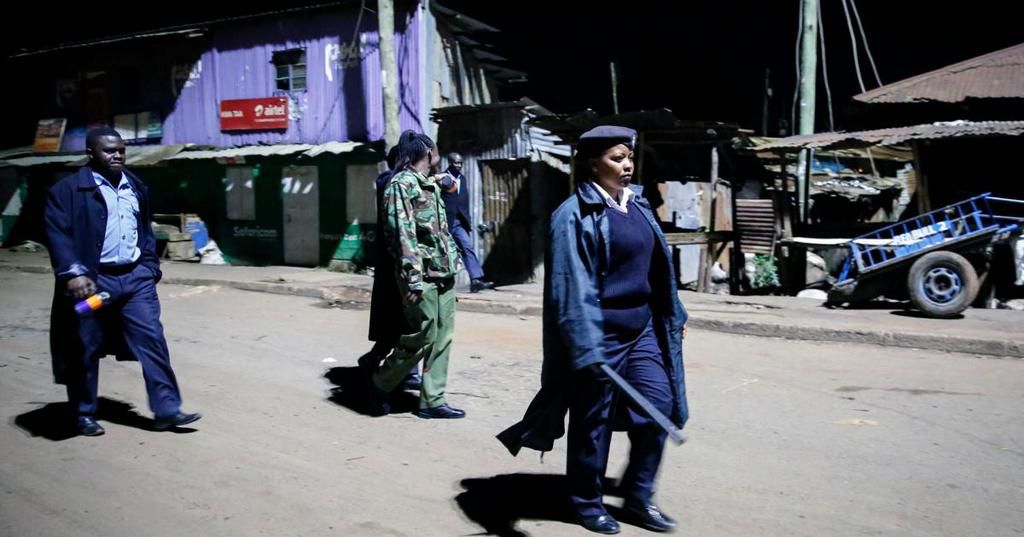 Police officers on patrol during the dusk to dawn curfew in Kenya