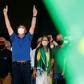 Brazilian President Jair Bolsonaro (C) compares the coronavirus to a "little flu," condemns the "hysteria" surrounding it and is urging the country to get back to work to stop an economic crash
