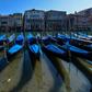 Gondolas sit empty in Venice's Grand Canal with Italy in lockdown to confront the dire impact of new coronavirus which, in one day, killed 475 more people in the country