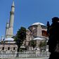 A woman takes a picture at the Hagia Sophia in Istanbul on July 2, 2020