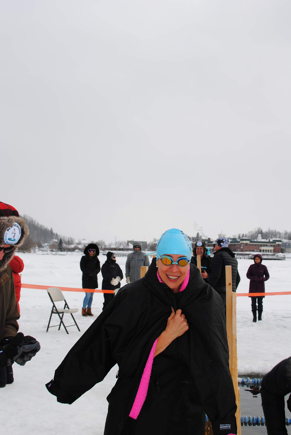 The author smiles post-race as volunteers work to ensure she warms back up safely.