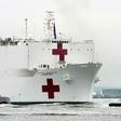 The USNS Comfort medical ship moves up the Hudson River past the Statue of Liberty as it arrives on March 30, 2020 in New York