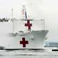 The USNS Comfort medical ship moves up the Hudson River past the Statue of Liberty as it arrives on March 30, 2020 in New York