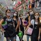 Shop sellers wear masks in the Brazilian city of Sao Paulo, where a state of emergency has been declared over the coronavirus pandemic