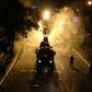 Iranian firefighters disinfect the streets of south Tehran in a bid to stem the spread of the coronavirus as the death toll heads on upwards