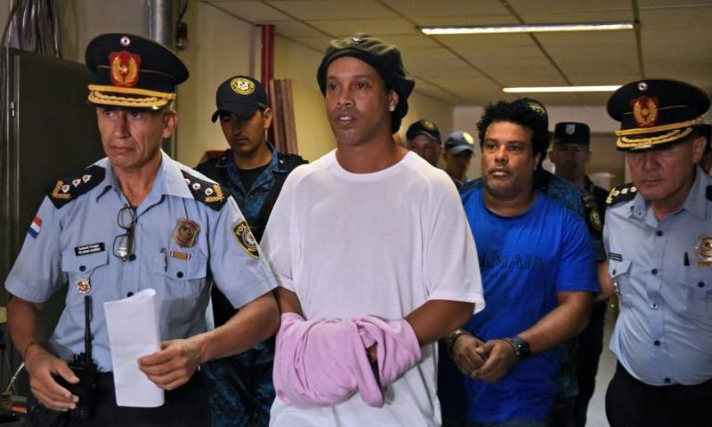 Retired Brazilian football star Ronaldinho (C) and his brother Roberto Assis were sent to jail in early March 2020 to await trial on charges of using false passports to enter Paraguay