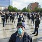 Supporters of the left-wing Vetevendosje party braved rain as they stood with masks and gloves in evenly-spaced rows in the centre of Pristina