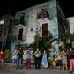 Neighbours applaud doctors and nurses who are battling the virus in Havana on March 30, 2020. Cuba is having trouble securing the medical supplies it needs to fight the pandemic