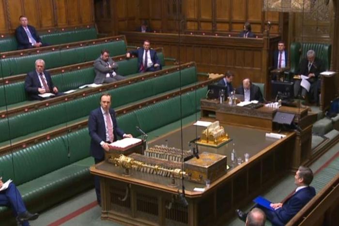 Britain's Health Secretary Matt Hancock makes a statement in parliament with social distancing measures in place