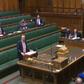Britain's Health Secretary Matt Hancock makes a statement in parliament with social distancing measures in place