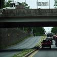 Protesters display signs over President Donald Trump's motorcade in Washington, DC