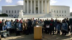 Norma McCorvey (C-Podium), the Roe of Roe v. Wade, speaks on the steps of the US Supreme Court on January 18, 2005 after petitioning the court to reverse its landmark decision that granted women the right to an abortion