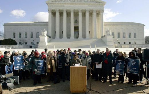 Norma McCorvey (C-Podium), the Roe of Roe v. Wade, speaks on the steps of the US Supreme Court on January 18, 2005 after petitioning the court to reverse its landmark decision that granted women the right to an abortion
