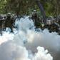 Demonstrators clash with Chilean riot police during a protest against Chilean President Sebastian Pinera's government in Santiago, on March 13, 2020.