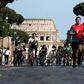 People exercise along Via dei Fori Imperiali in central Rome as Italy begins the careful process of easing its virus lockdown