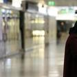 Wearing a mask and gloves in a terminal of Franz-Josef-Strauss Airport in Munich
