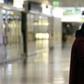Wearing a mask and gloves in a terminal of Franz-Josef-Strauss Airport in Munich