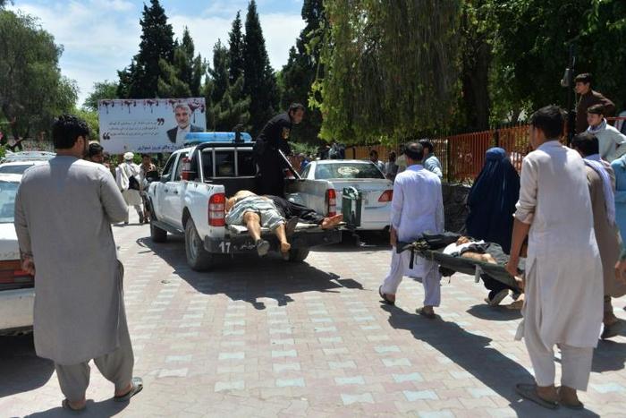 Injured mourners are taken to hospital after a suicide bomb attack on a funeral in eastern Afghanistan