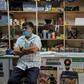 In a store that sells bicycle spare parts, the Shah brothers are feeling the impact of the pandemic on the economy