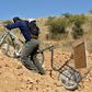 Bolivian teacher Wilfredo Negrete has fixed a trolley to the back of his bicycle to help him cart around his whiteboard as he visits pupils to teach them during the coronavirus lockdown