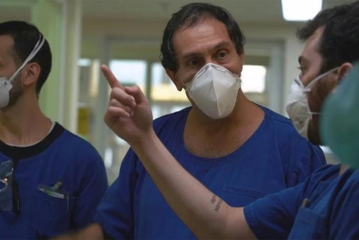 AFPTV filmed doctors like Jaques Sztajnbok (C) in Sao Paulo and other medical workers around the world in action as they battled coronavirus at work and at home
