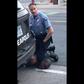 A Minneapolis police officer holds his knee to the neck of George Floyd, who died in police custody.
