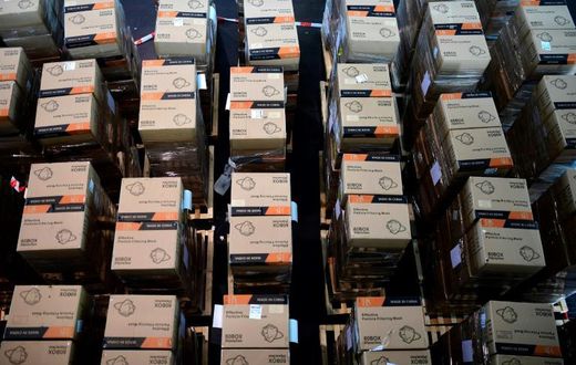 Boxes with protective masks from China -- which has exerted growing influence during the COVID-19 crisis -- are seen at a state camp in Dusseldorf, Germany, in June 2020