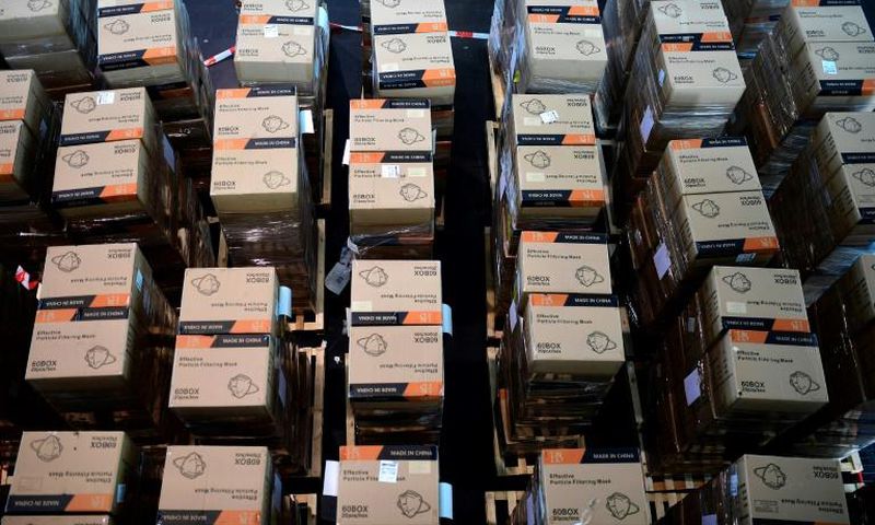 Boxes with protective masks from China -- which has exerted growing influence during the COVID-19 crisis -- are seen at a state camp in Dusseldorf, Germany, in June 2020