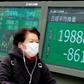 Equities in Tokyo have plunged almost six percent as Asian markets are hammered by virus fears and a crash in oil prices
