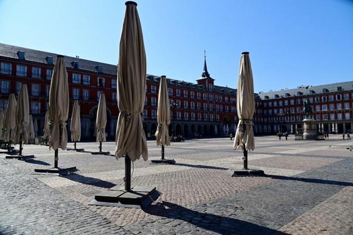 Public spaces such as the Plaza Mayor in central Madrid have already largely emptied