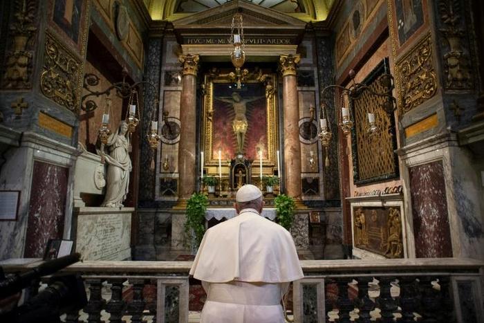 The 83-year-old pontiff's unannounced visit to a church with a crucifix from the times of the Great Plague came with Italy's hospitals running out beds