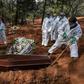 Employees bury the coffin of a person who died from COVID-19 at the Vila Formosa cemetery, in the outskirts of Sao Paulo, Brazil on May 20, 2020