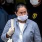 Peruvian politician Keiko Fujimori wears a face mask -against the spread of the COVID-19 coronavirus- while leaving Santa Monica jail in Lima on May 04, 2020
